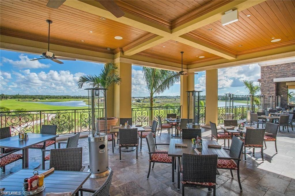 9590 Trevi Court, Unit 5337 Naples, FL 34113 - Photo 28 of 35 a view of a dining room with furniture window and outside view