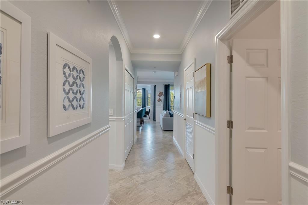 9590 Trevi Court, Unit 5337 Naples, FL 34113 - Photo 5 of 35 a view of a hallway with a white walls