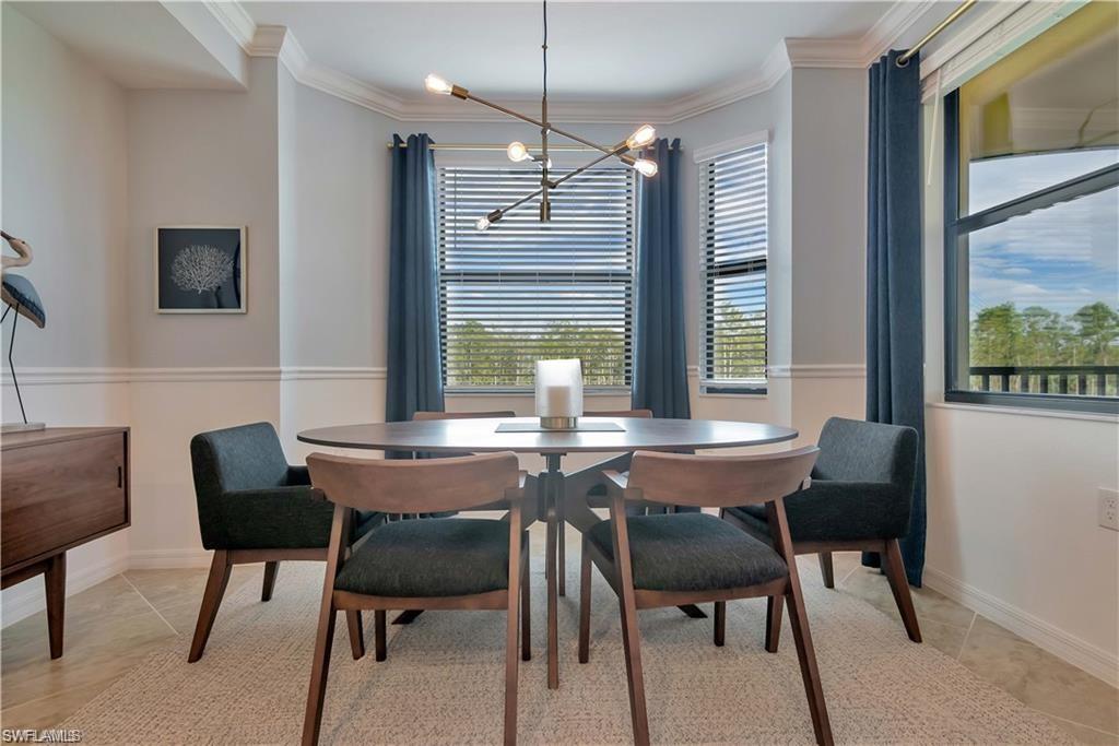 9590 Trevi Court, Unit 5337 Naples, FL 34113 - Photo 6 of 35 a view of a dining room with furniture and window