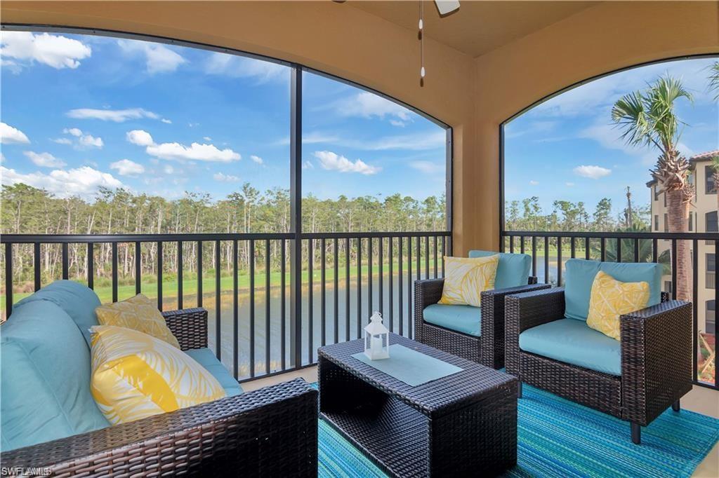 9590 Trevi Court, Unit 5337 Naples, FL 34113 - Photo 9 of 35 a view of a chairs and deck in the balcony