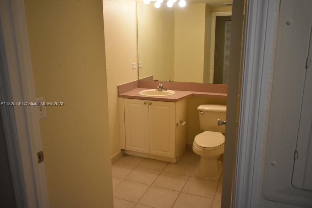 6520 West Sample Road, Unit 6520 Coral Springs, FL 33067 - Photo 14 of 33 a bathroom with a sink and a toilet