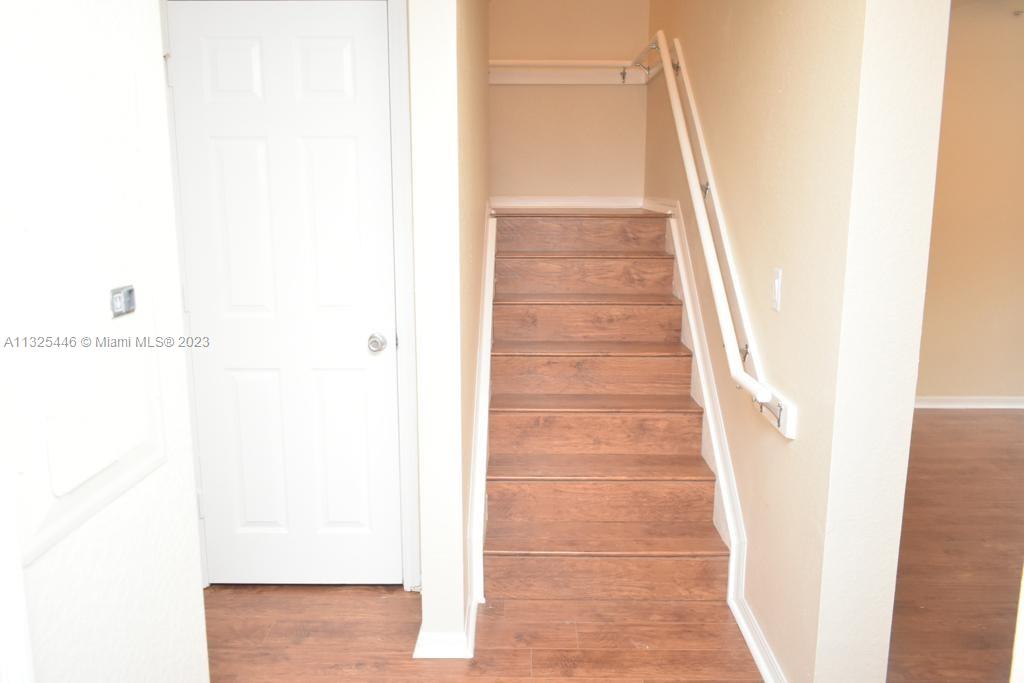 6520 West Sample Road, Unit 6520 Coral Springs, FL 33067 - Photo 16 of 33 a view of staircase with white walls