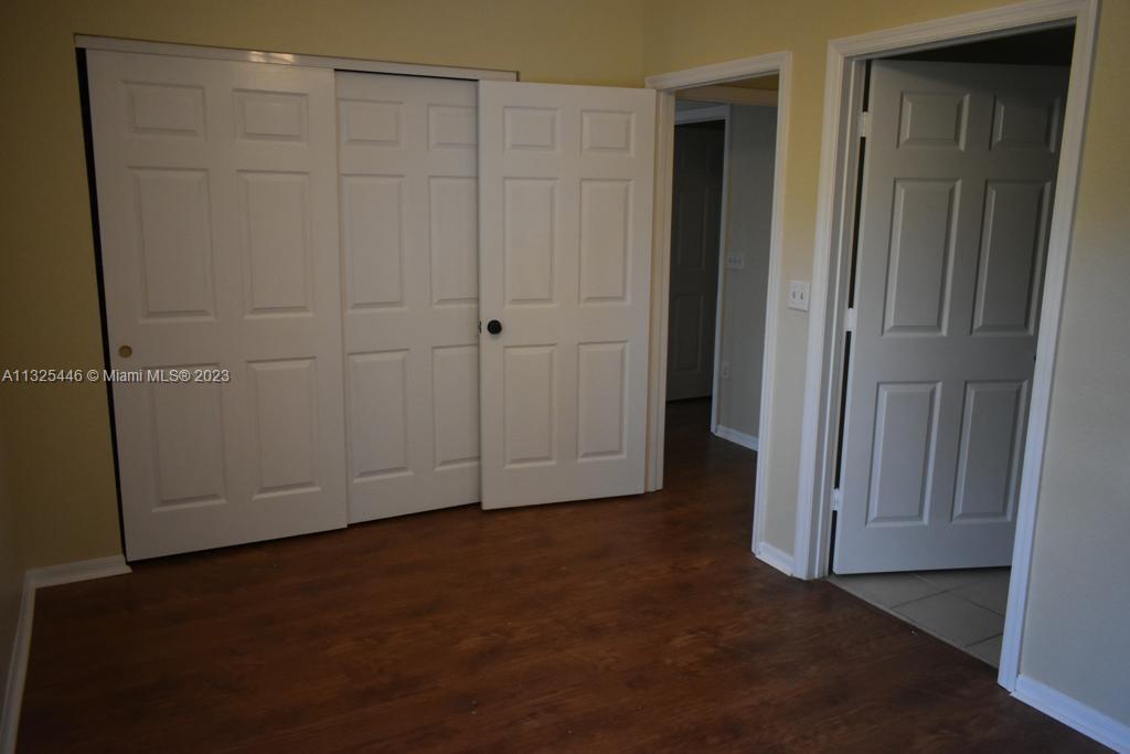 6520 West Sample Road, Unit 6520 Coral Springs, FL 33067 - Photo 27 of 33 an empty room with closet area