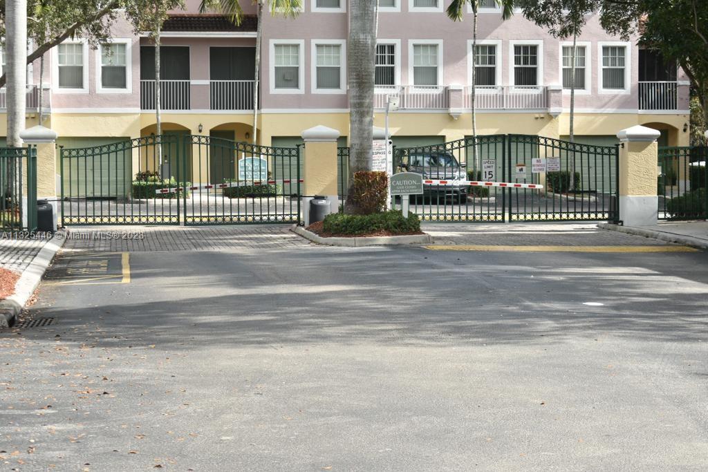 6520 West Sample Road, Unit 6520 Coral Springs, FL 33067 - Photo 30 of 33 front view of a house with a street