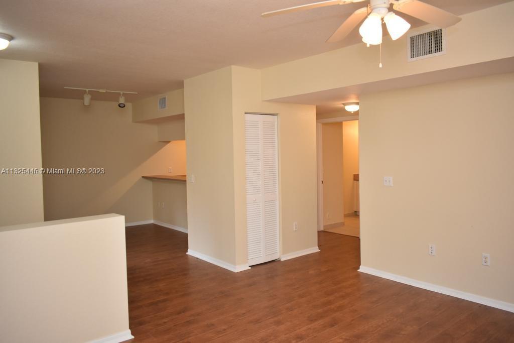 6520 West Sample Road, Unit 6520 Coral Springs, FL 33067 - Photo 7 of 33 a view of a room with wooden floor
