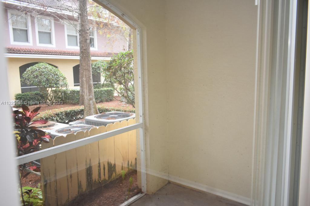 6520 West Sample Road, Unit 6520 Coral Springs, FL 33067 - Photo 10 of 33 a view of a window and an outdoor space