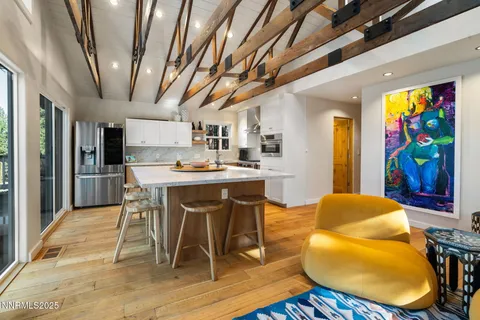 a view of a dining room with furniture and a rug