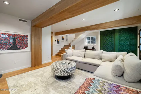 a living room with furniture and a rug