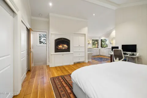 a bedroom with bed and a flat screen tv