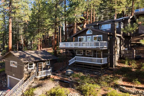 a view of house with a yard