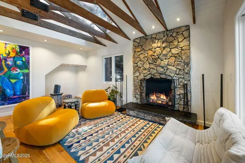 a bedroom with two beds and a fireplace