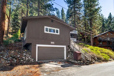 a house with trees in the background
