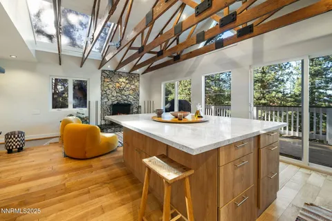 a kitchen with a sink and living room