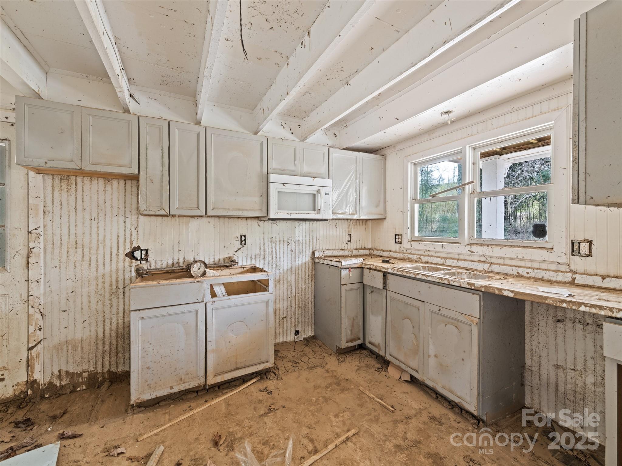 61 Riverbend Street Canton, NC 28716 - Photo 12 of 24 a kitchen with a sink stove and cabinets