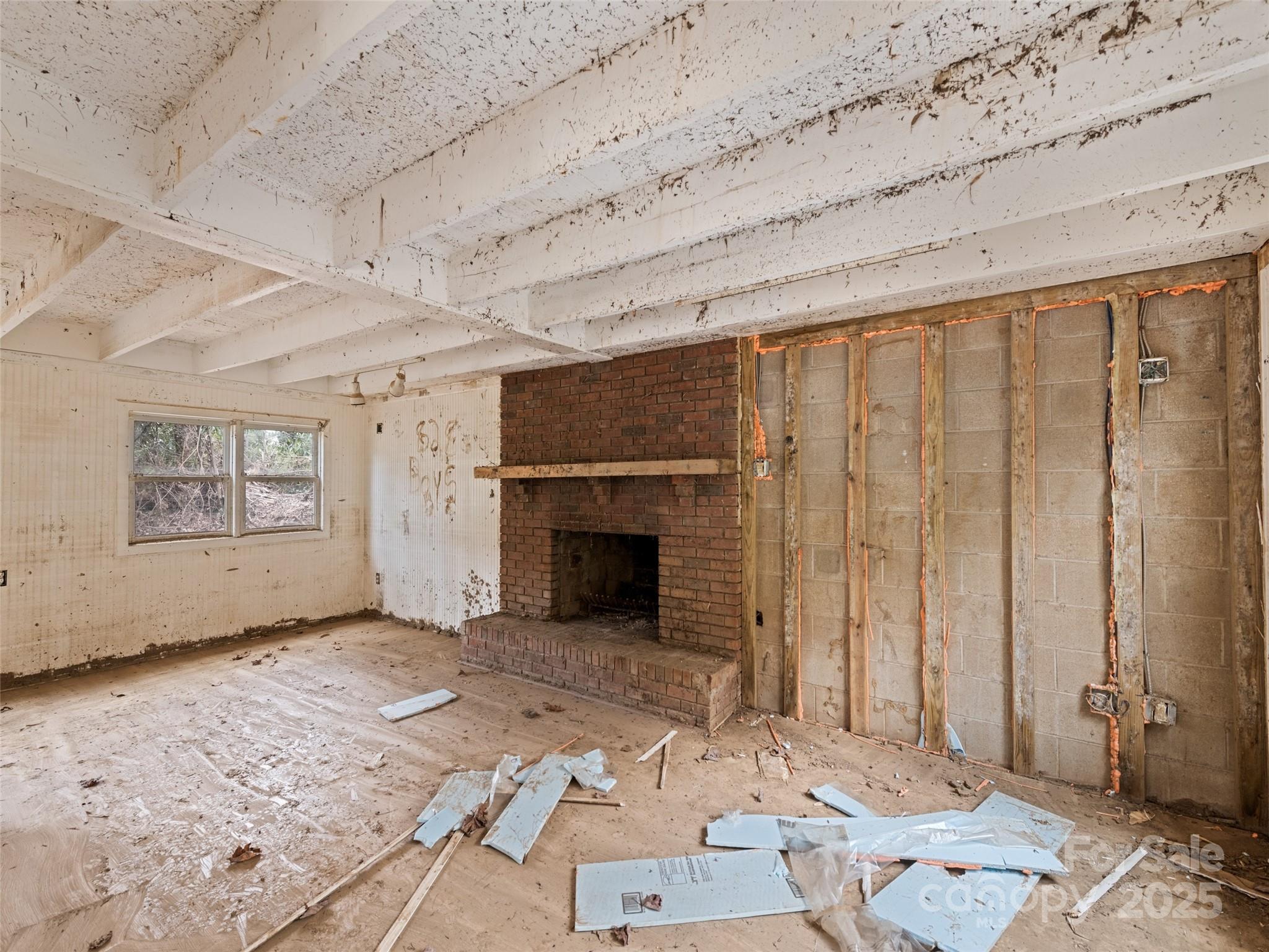 61 Riverbend Street Canton, NC 28716 - Photo 14 of 24 a view of a livingroom with wooden floor and a fireplace