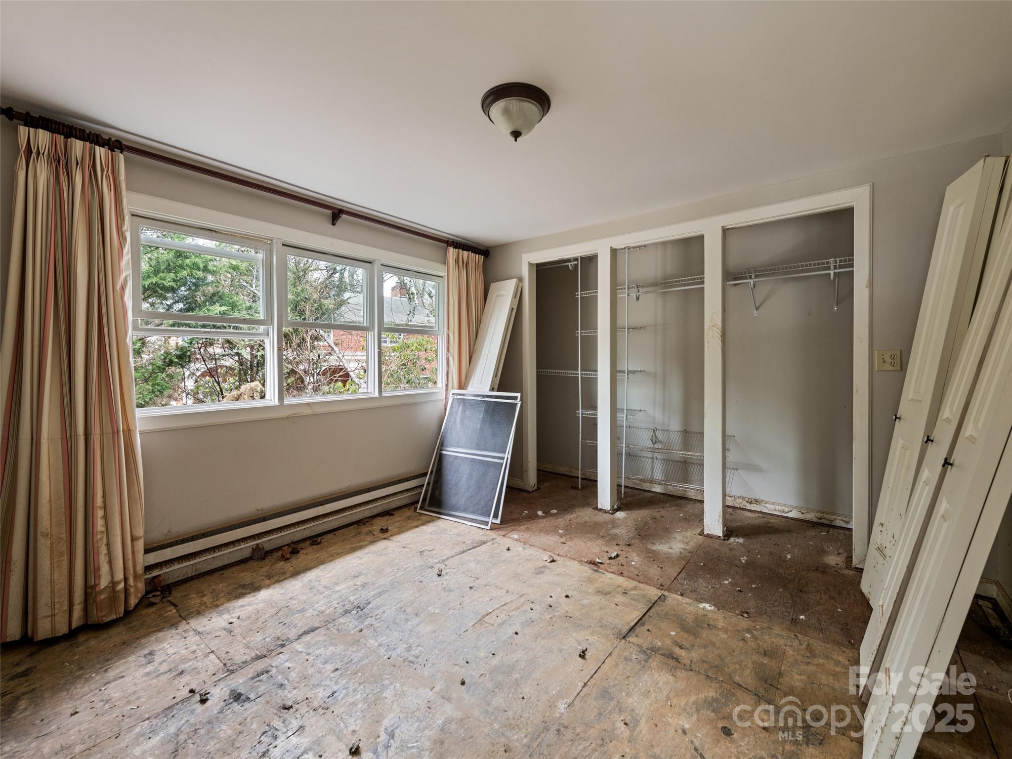61 Riverbend Street Canton, NC 28716 - Photo 23 of 24 a view of an empty room with a window