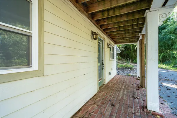 a view of a pathway both side of house