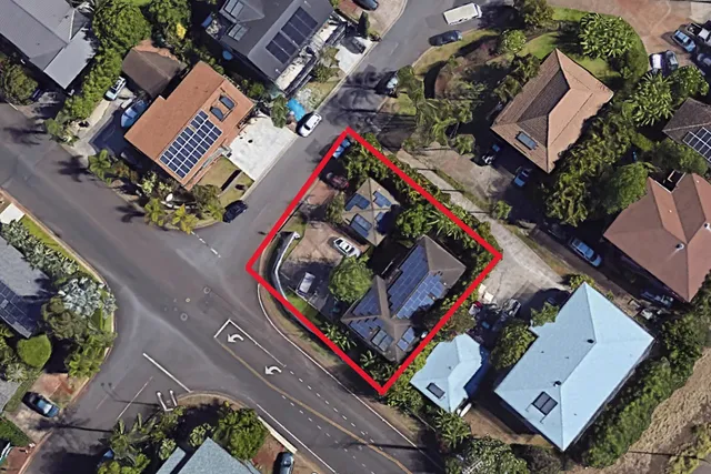 an aerial view of a house with a garden