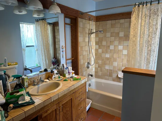 a view of a backyard with swimming pool