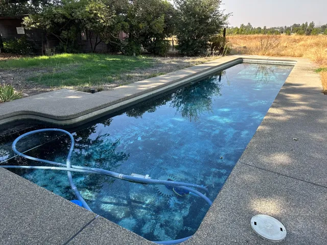 a backyard of a house with lots of green space