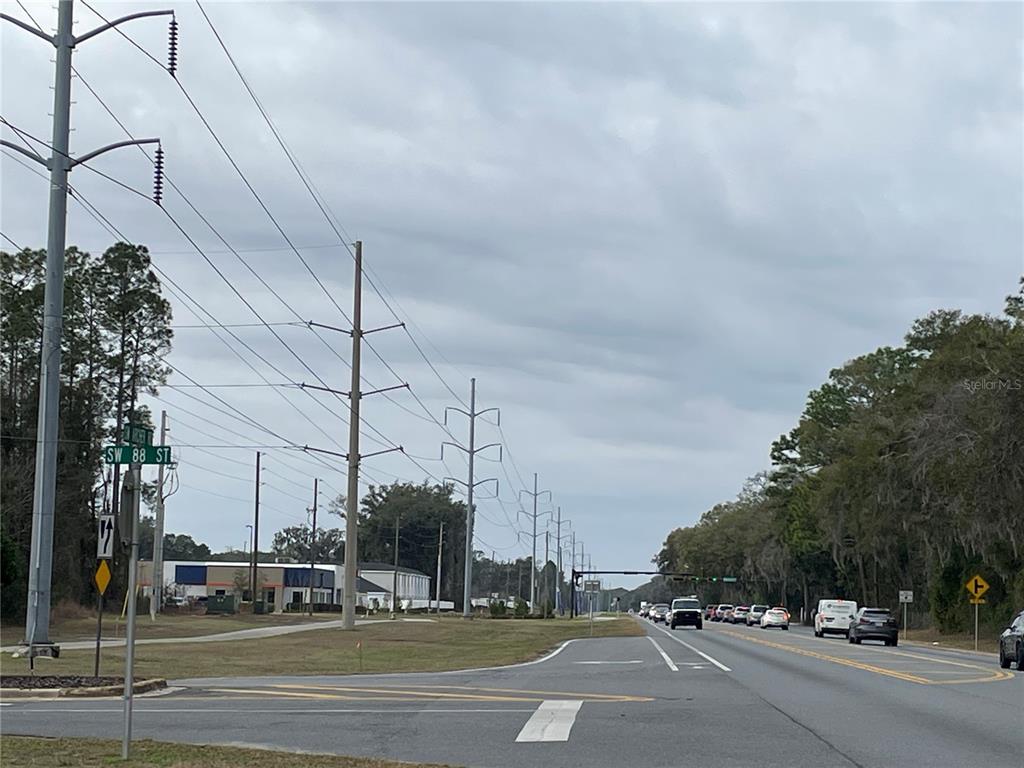 8717 Southwest Archer Road Gainesville, FL 32608 - Photo 13 of 26 a view of a city street with lots of buildings