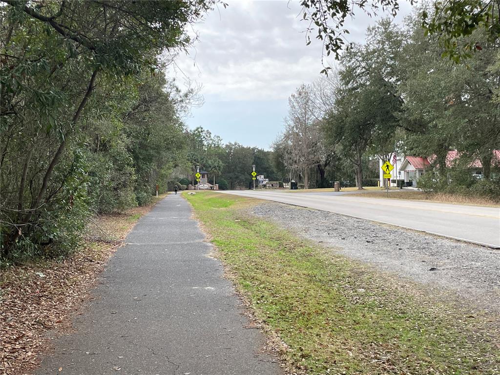 8717 Southwest Archer Road Gainesville, FL 32608 - Photo 26 of 26 a view of a road with a yard