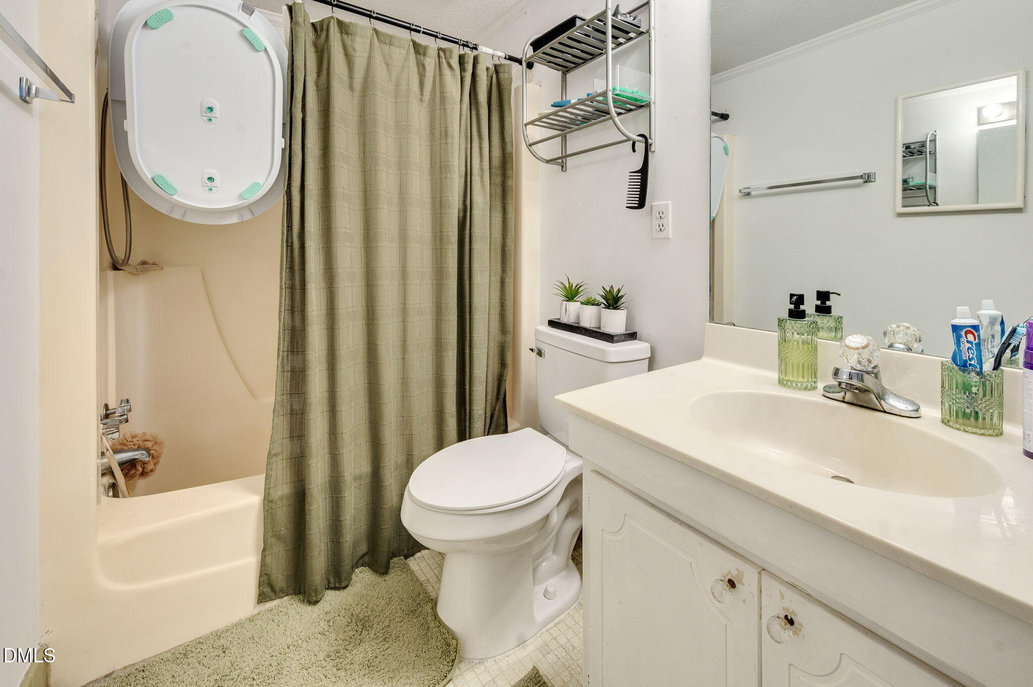 4603 Edwards Mill Road Raleigh, NC 27612 - Photo 20 of 26 a bathroom with a sink toilet and shower