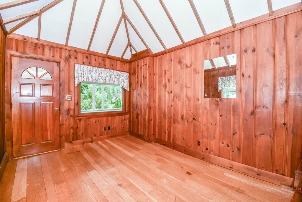 34 Farnum Road Waltham, MA 02453 - Photo 11 of 29 a view of an empty room with a window and wooden floor