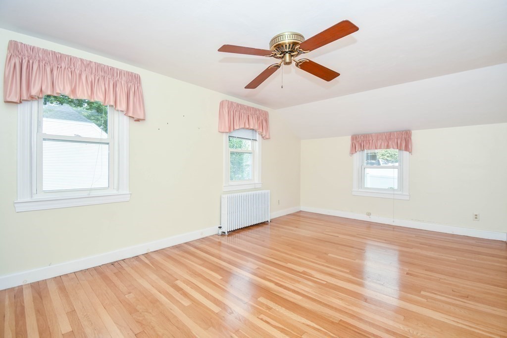 34 Farnum Road Waltham, MA 02453 - Photo 15 of 29 a view of empty room with wooden floor and fan