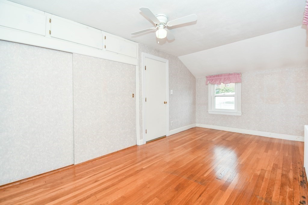 34 Farnum Road Waltham, MA 02453 - Photo 17 of 29 an empty room with wooden floor ceiling fan and windows