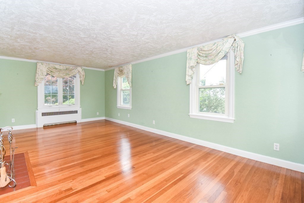 34 Farnum Road Waltham, MA 02453 - Photo 6 of 29 an empty room with wooden floor and windows