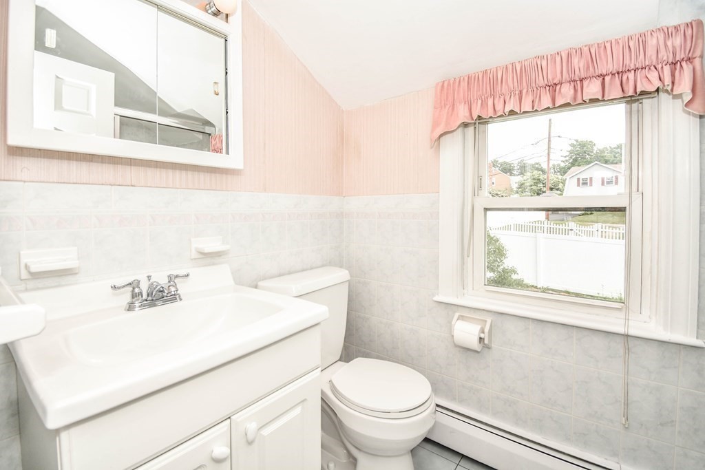 34 Farnum Road Waltham, MA 02453 - Photo 8 of 29 a bathroom with a sink a toilet and a window