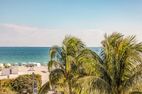 a view of a ocean with a building in the background