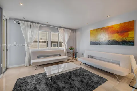 a living room with a couch and a flat screen tv