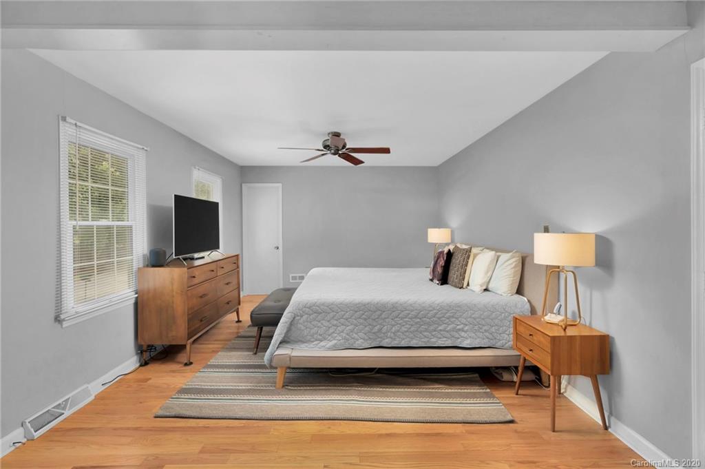 7101 Graburn Road Charlotte, NC 28226 - Photo 17 of 25 a bedroom with furniture and a flat screen tv