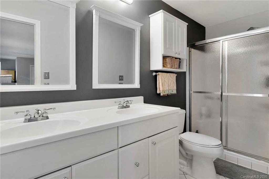 7101 Graburn Road Charlotte, NC 28226 - Photo 18 of 25 a bathroom with a sink toilet and shower