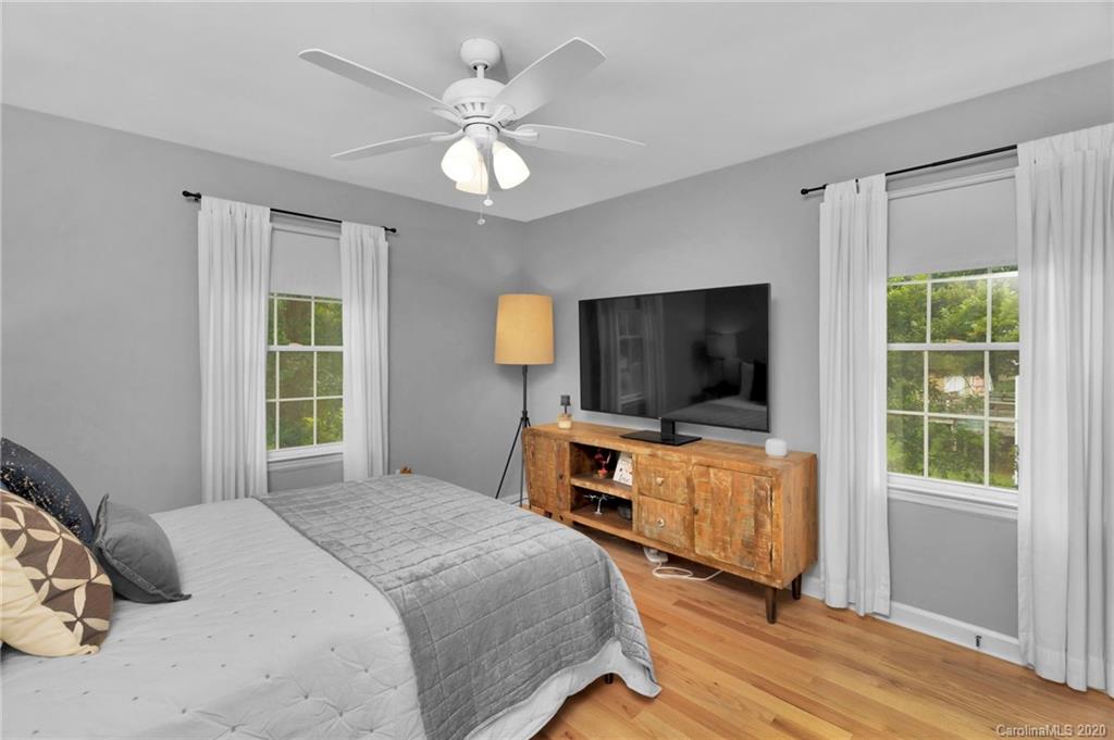 7101 Graburn Road Charlotte, NC 28226 - Photo 20 of 25 a bedroom with furniture and flat screen tv