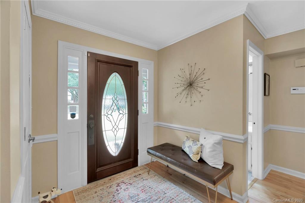 7101 Graburn Road Charlotte, NC 28226 - Photo 3 of 25 a grandfather clock sitting in the corner of a room