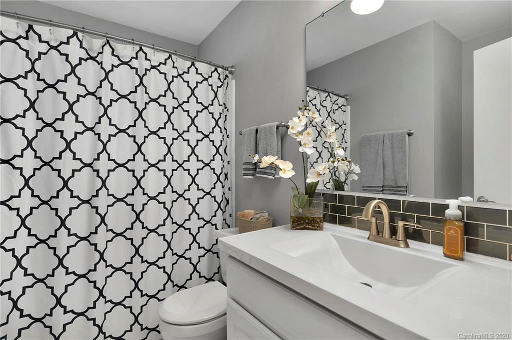 7101 Graburn Road Charlotte, NC 28226 - Photo 21 of 25 a bathroom with a sink and a toilet
