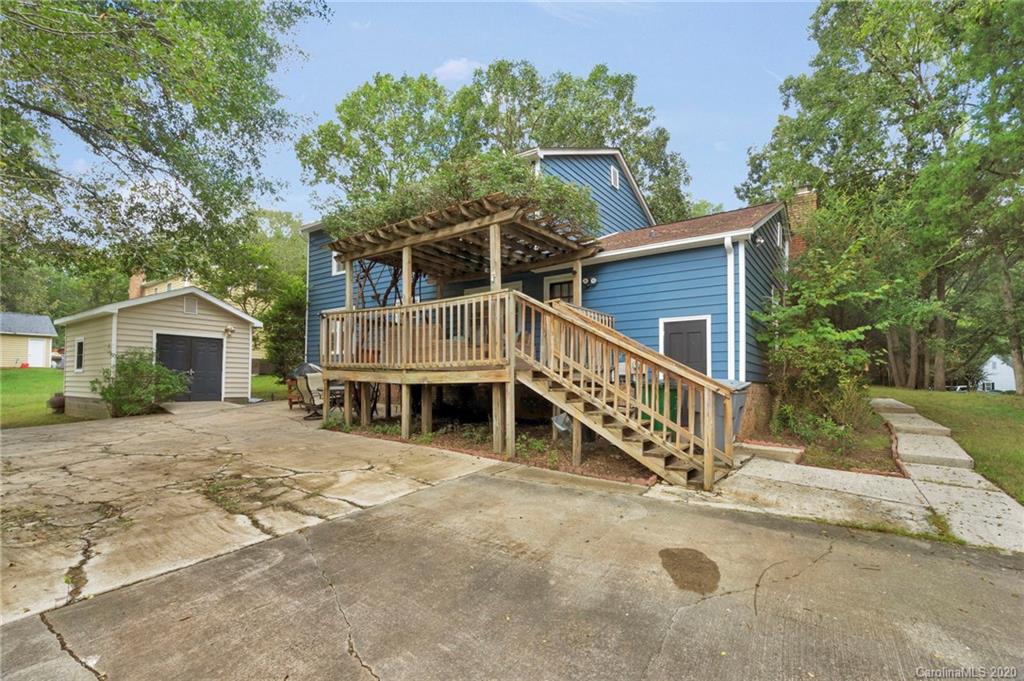7101 Graburn Road Charlotte, NC 28226 - Photo 23 of 25 a view of a house with a yard