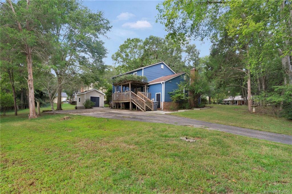 7101 Graburn Road Charlotte, NC 28226 - Photo 24 of 25 a front view of a house with garden