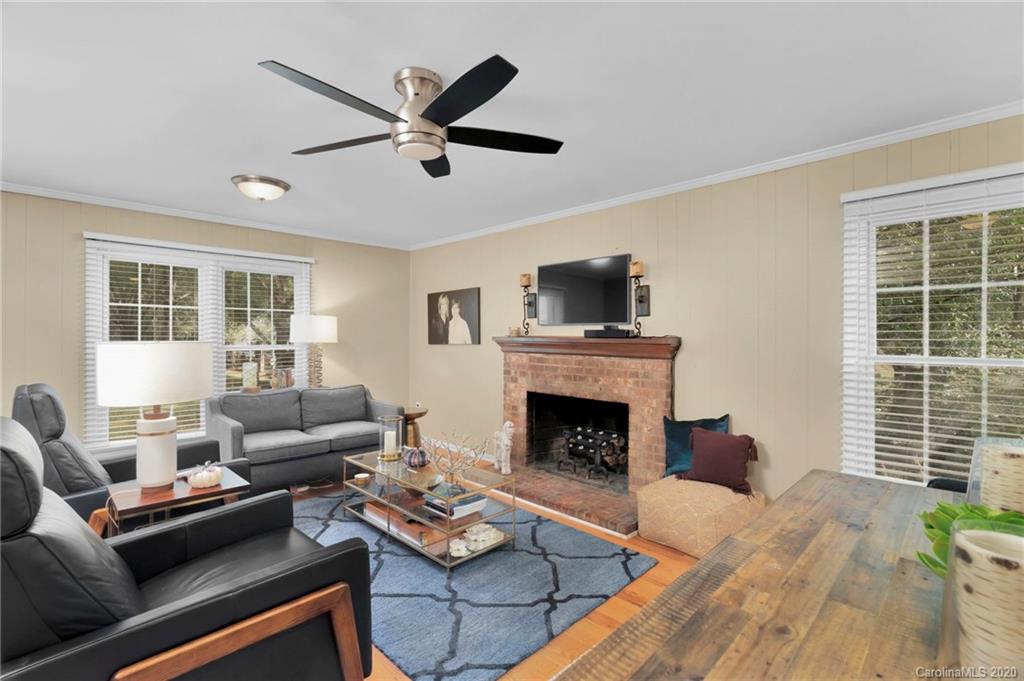 7101 Graburn Road Charlotte, NC 28226 - Photo 5 of 25 a living room with furniture and a fireplace