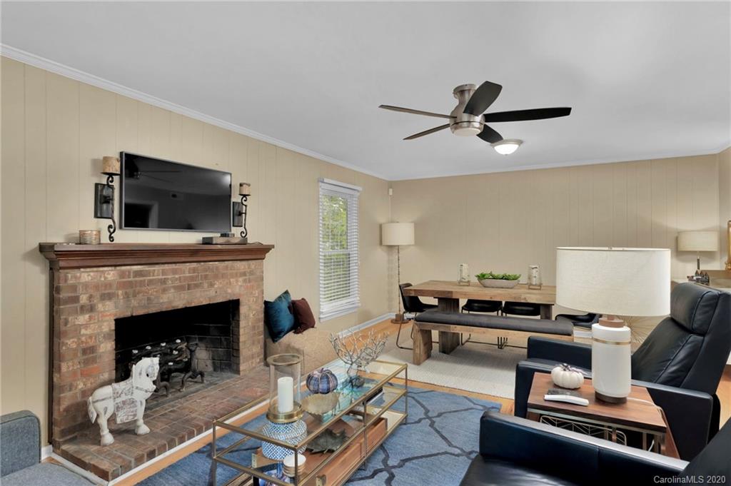 7101 Graburn Road Charlotte, NC 28226 - Photo 7 of 25 a living room with furniture and a fireplace