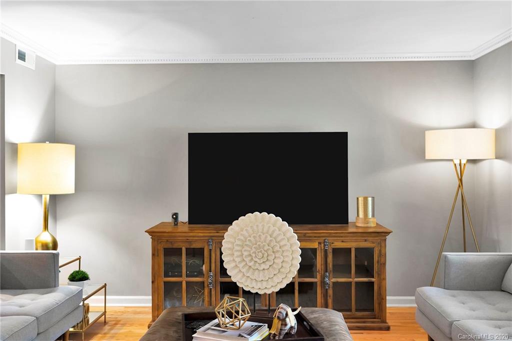 7101 Graburn Road Charlotte, NC 28226 - Photo 9 of 25 a living room with a couch and a lamp