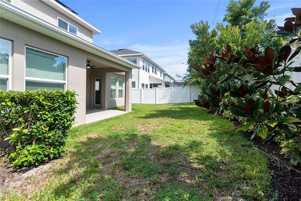 16409 Lucia Gardens Lane Tampa, FL 33625 - Photo 32 of 48 a view of a house with a yard