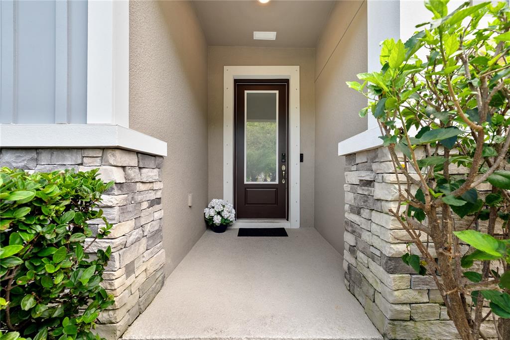 16409 Lucia Gardens Lane Tampa, FL 33625 - Photo 7 of 48 a front view of a house with a garden