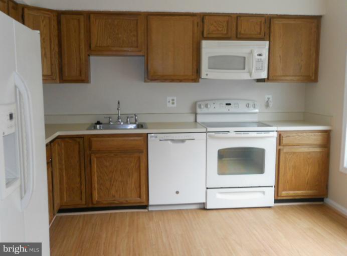 3034 Choctaw Ridge Court Woodbridge, VA 22192 - Photo 2 of 18 a utility room with sink dryer and washer