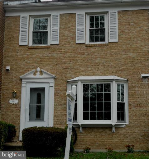 3034 Choctaw Ridge Court Woodbridge, VA 22192 - Photo 17 of 18 a front view of a house with a yard