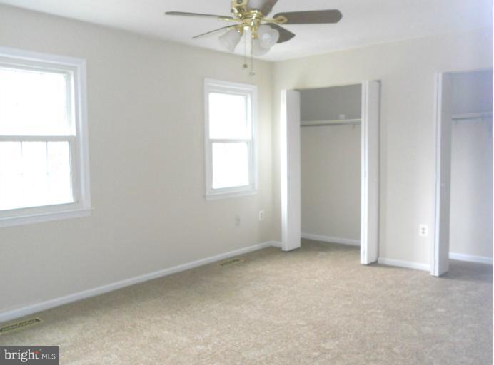3034 Choctaw Ridge Court Woodbridge, VA 22192 - Photo 6 of 18 an empty room with a window and a fan