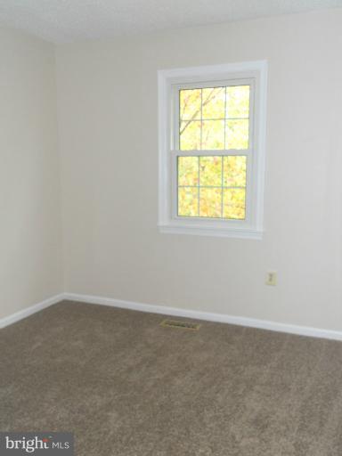3034 Choctaw Ridge Court Woodbridge, VA 22192 - Photo 10 of 18 an empty room with a window
